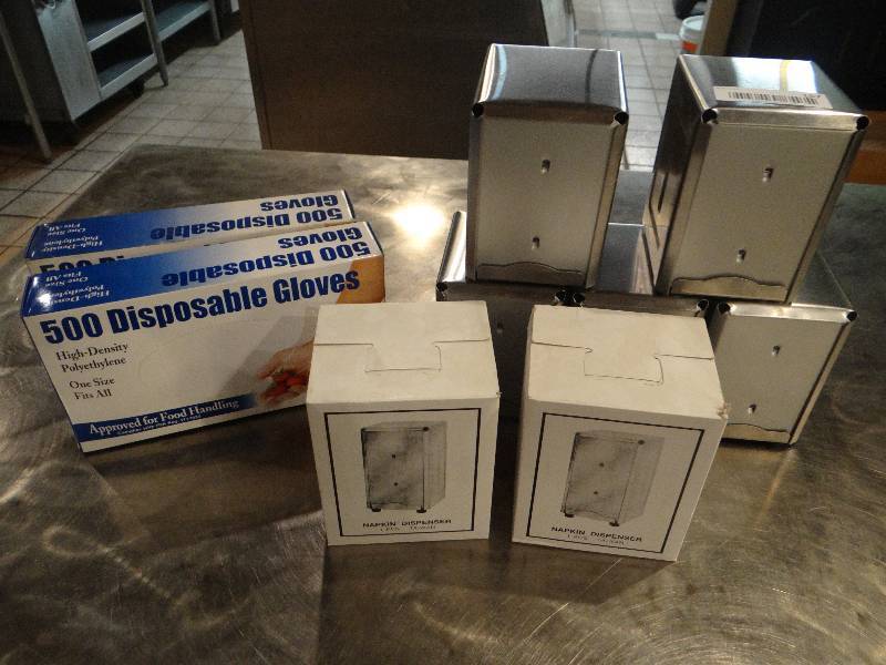 lot 157 image: Lot of 7 New Stainless Steel Napkin Dispensers - 2 in Boxes.  2 Boxes of Diposable Gloves - 1 is open.
