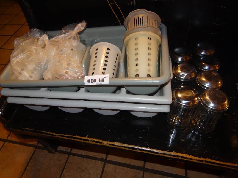 lot 162 image: Lot of 3 Utensil Bins, 6 Utensil Cannisters, Large Lot of Metal Forks, Knives, Spoons, & 7 Sugar Shakers.