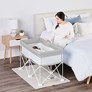 lot 26036 image: Regalo My Crib Portable Infant Bassinet, Includes Design Padded Insert, Travel Carry Bag, Support Tubes, Step Safety Locking MechanismUSED, NOT FULLY INSPECTED