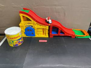 lot 1641 image: Fisher Price Little People Racer, Quiet Counters