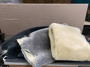 lot 1643 image: Sheep Hides Light Gray (1), Dark Gray (1), White (1)