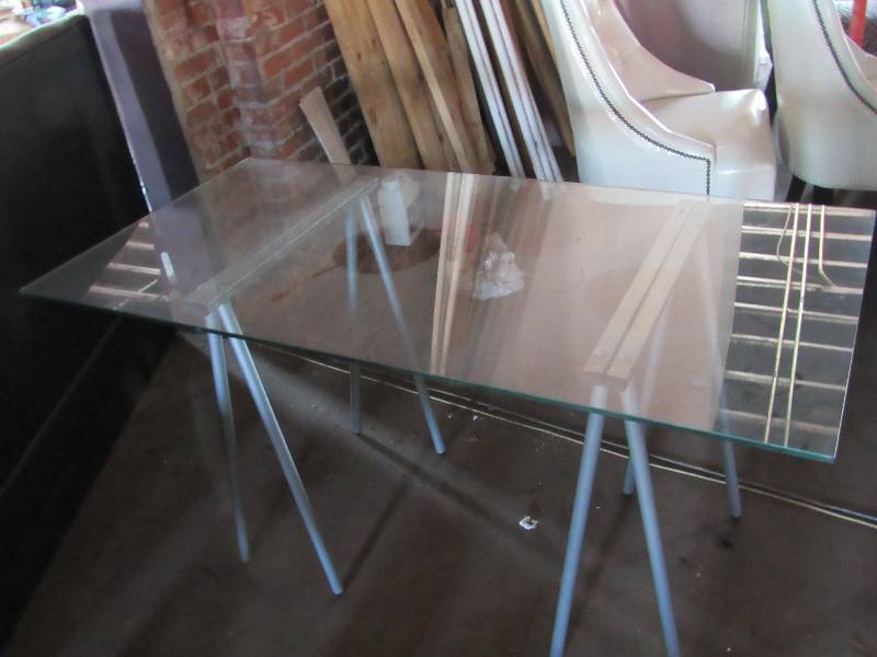 lot 1838 image: 55 Glass Top Table On Metal Saw Horse Style Legs
