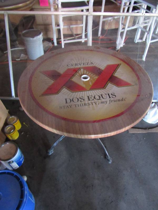lot 1863 image: 35 Round Branded Dos Equis Out Door Table