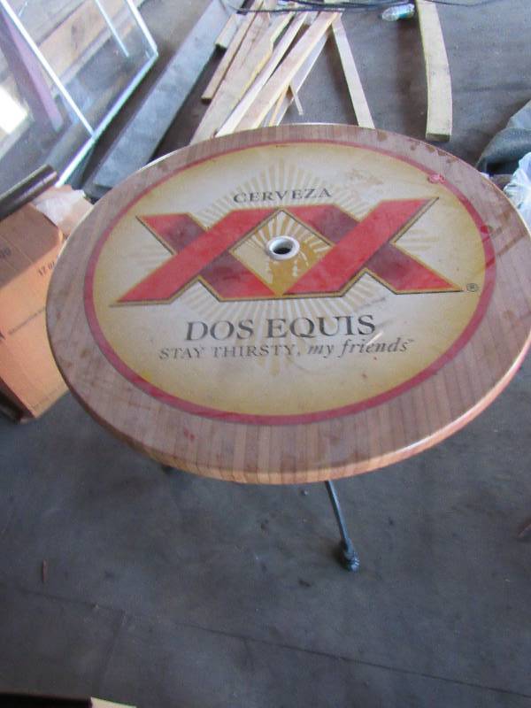 lot 1864 image: 35 Round Branded Dos Equis Out Door Table