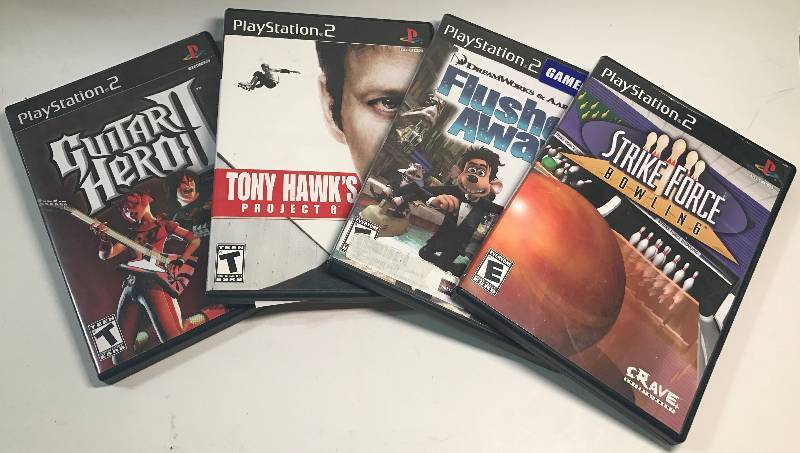 lot 2152 image: 4 Sony Playstaion 2 Games - Guitar Hero II, Tony Hawk, Flushed Away & Strike Force Bowling