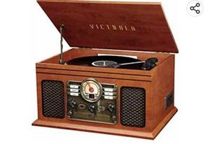 lot 67192 image: Victrola Nostalgic 7-in-1 Bluetooth Record Player & Multimedia Center with Built-in Speakers - 3-Speed Turntable, CD & Cassette Player, AMFM Radio, USB  Wireless Music Streaming  Mahogany