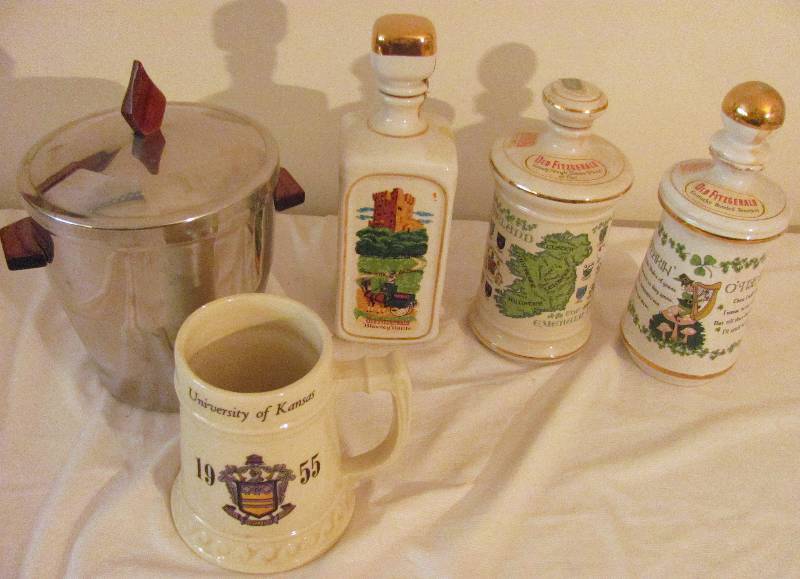 lot 6361 image: BAR ITEMS - 3 Decanters, KU - University of Kansas Mug, Chrome Ice Bucket & Swizzle Sticks