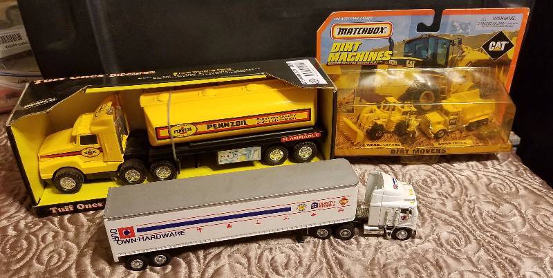 lot 7854 image: Die cast models PENNZOIL Tractor Trailer, Matchbox CAT Dirt Machines  and more - some NEW in BOX