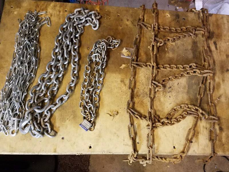 lot 7989 image: Bucket of Chains and One Tire Chain