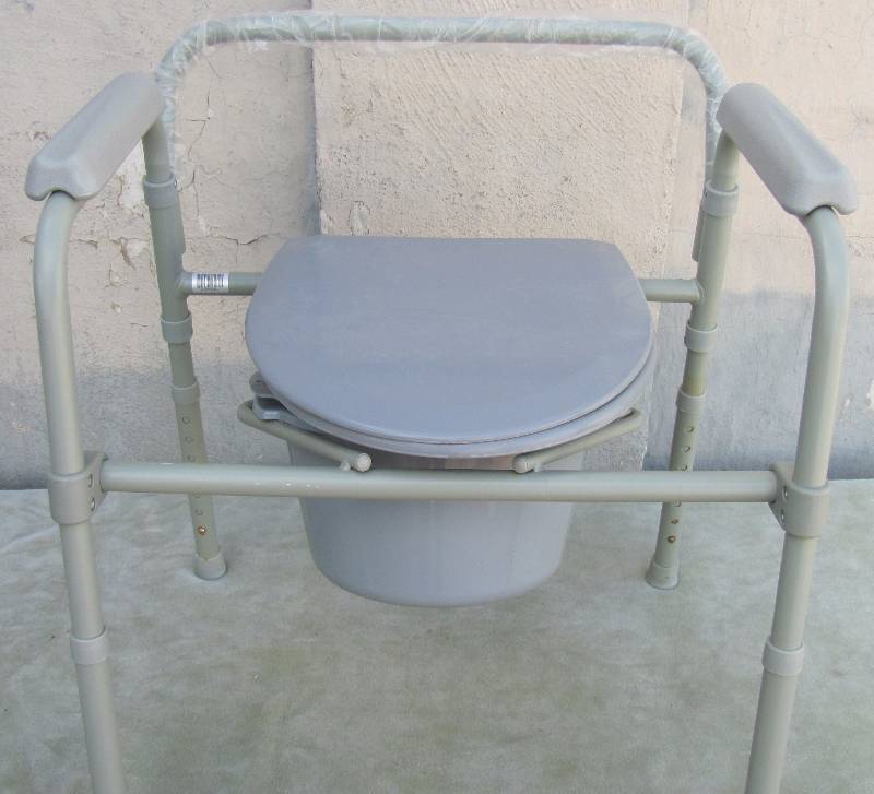 lot 7173 image: Commode - NEVER USED - Never Fully Assembled- Adjustable Height Portable Toilet or Fishing Chair with built-in bait bucket