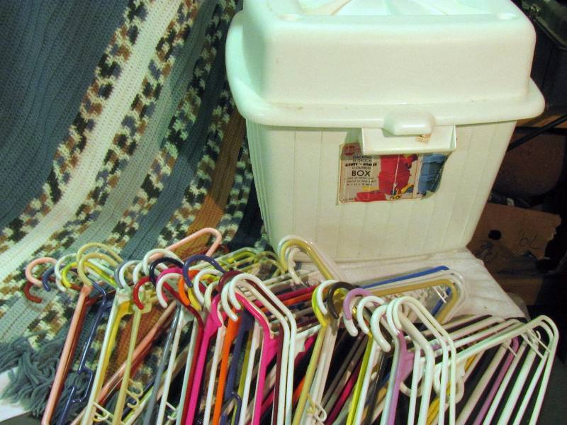 lot 6223 image: Misc household stuff - hangers, plastic storage box and afghan
