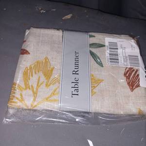lot 44431 image: Retail - $25.99 Design Imports 14 x 70 Scattered Leaves Table, HARVEST