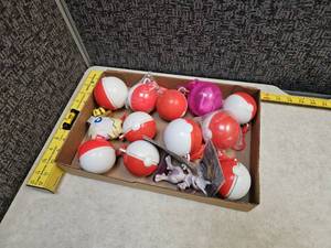 lot 69 image: Flat of Pokemon Balls with toys inside