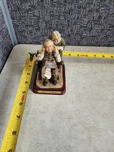 lot 98 image: Marlo Collection - Old Man and Woman Listening to Phone Radio