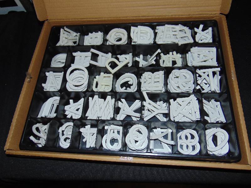 lot 1085 image: (1) box of (300) ct. 2 Sign Letters, white Helvitica Font, 150.00 value