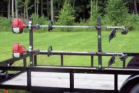 lot 1062 image: Trailer Mount String trimmer rack, holds 2 string trimmers, mounting bolts included, trimmer not included