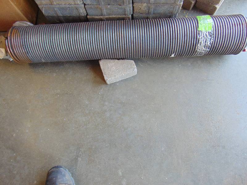 lot 1213 image: Large overhead Door Spring 40 x 6-12 diameter