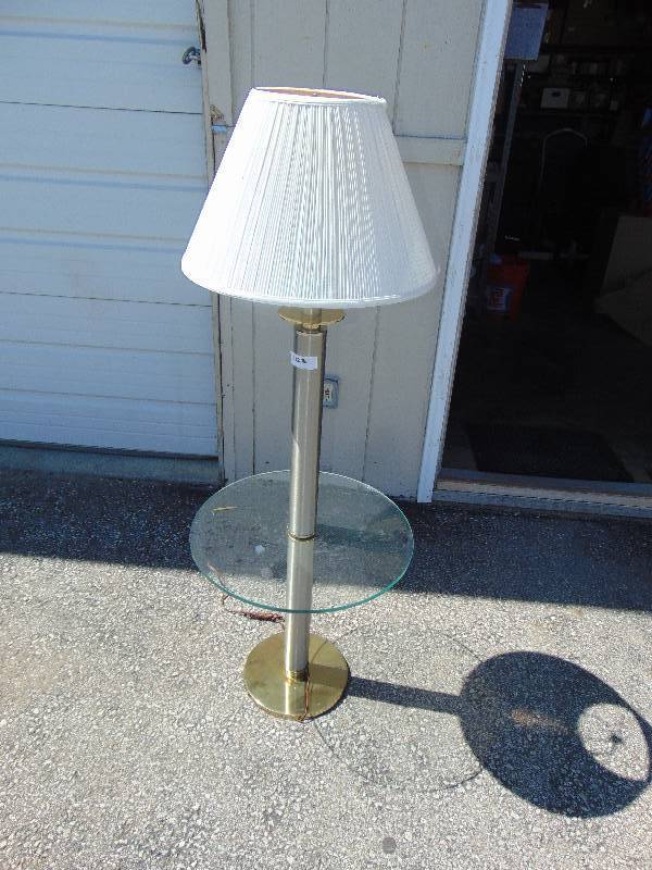 lot 1223 image: Lamp Table with 20 diameter glass top and brass base, overall height 55 tall, table height 19 tall