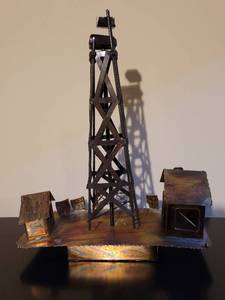 lot 230 image: Vintage Copper Oil Rig Music Box.