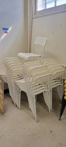 lot 2530 image: Lot of 25 White Armless Stackable Chairs