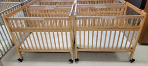 lot 13683 image: (2) Wooden Rolling Baby Cribs With Mattresses