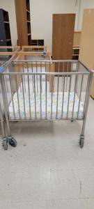lot 13690 image: Stainless Steel Fire Evacuation Baby Crib