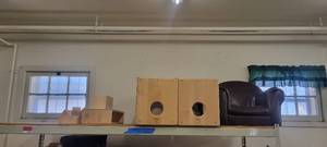 lot 13906 image: Contents of Shelf - Brown Childrens Lounge Chair, COMMUNITY Products, and Other Items