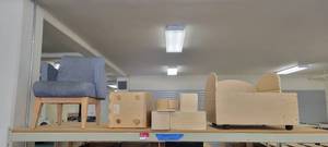 lot 13910 image: Contents of Shelf - Kaplan Products, Blue Lounge Chair, and More