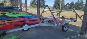 lot 2705 image: Ultralight Canfield Aluminum Kayak  Boat Trailer