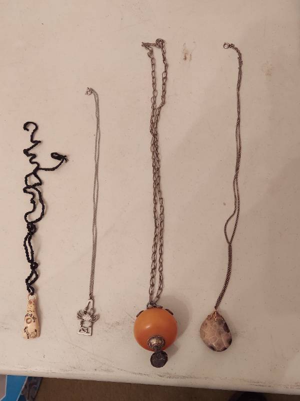 lot 6576 image: 4 Necklaces - 1 Appears to be Tooth