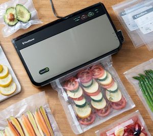lot 2150 image: FoodSaver Vacuum Sealer System with Accessories, Red in Color, NEW