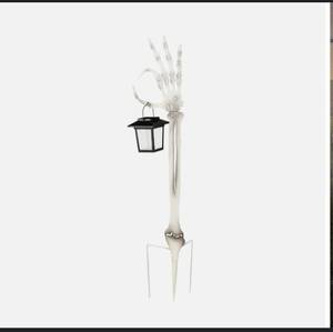 lot 2320 image: Skeleton Hand Garden Stake wSolar Lantern from Evergreen, White in Color, NEW