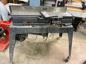 lot 1004 image: Craftsman jointer planer on rolling locking stand