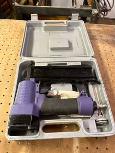 lot 1009 image: Central pneumatic air brad nailer in case