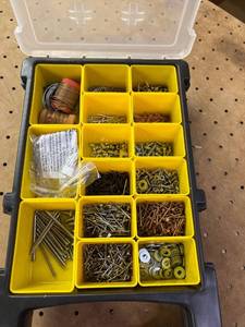 lot 1017 image: Stanley tool organizer, full of nuts and bolts