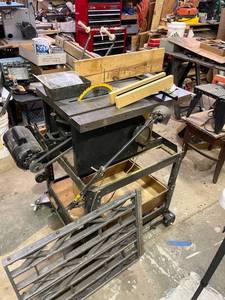 lot 1018 image: Craftsman 10 inch table saw with extension piece on rolling locking stand