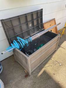lot 2027 image: Suncast outdoor storage bin with contents