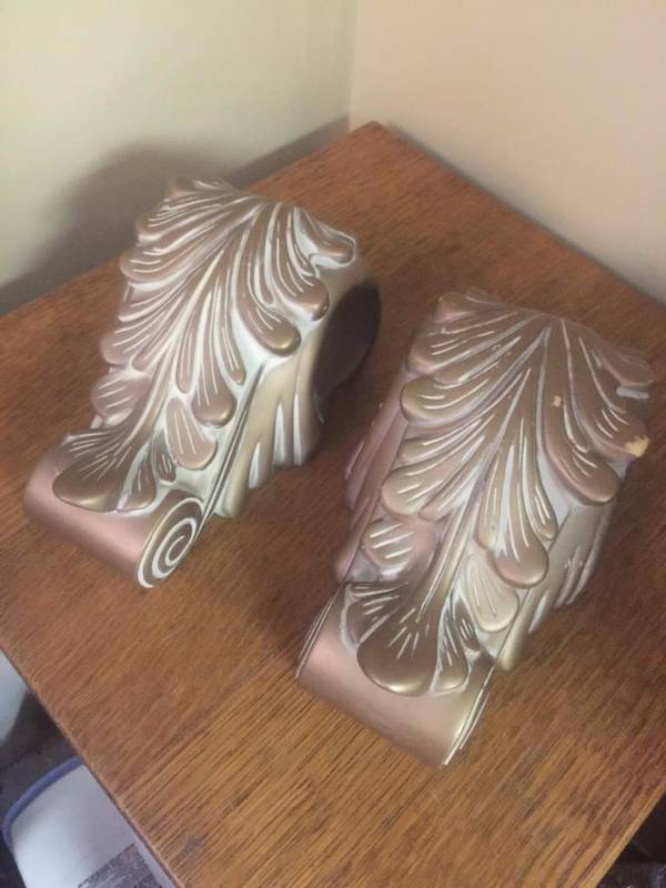 lot 38 image: Two large decorative curtain rod holders...