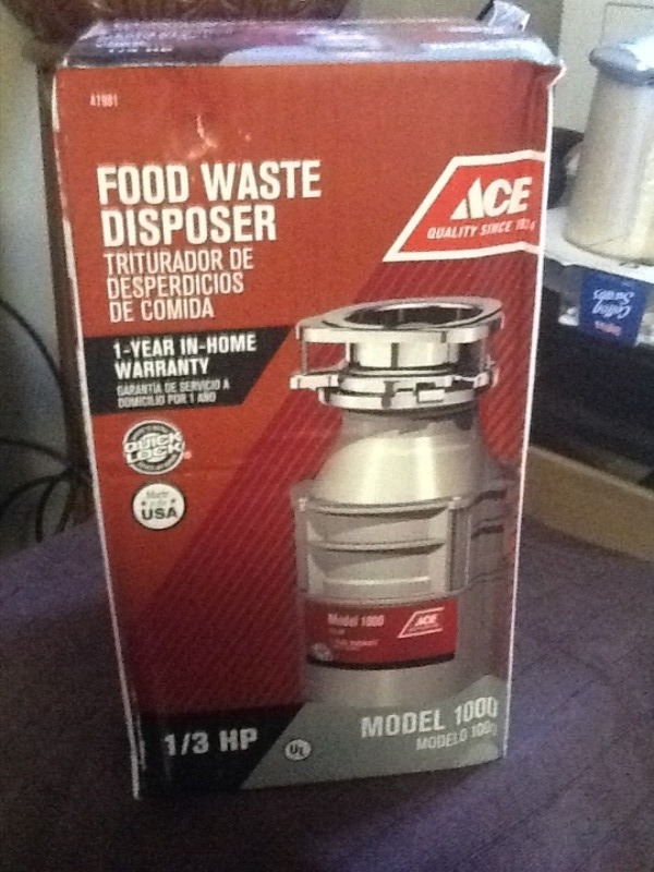 lot 7686 image: New in box garbage disposal as a picture