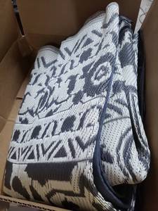 lot 2961 image: Extra Large Woven Outdoor Ground Mat With Stakes And Carry Case, GrayWhite