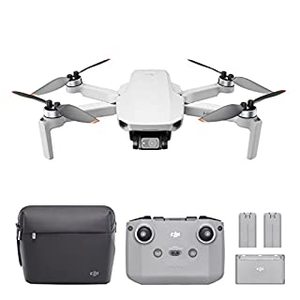 lot 2687 image: DJI Mini 2 Fly More Combo -- Ultralight Foldable Drone, 3-Axis Gimbal with 4K Camera, 12MP Photos, 31 Mins Flight Time, OcuSync 2.0 10km HD Video Transmission, Quick Shots, Gray. (Retails $500)