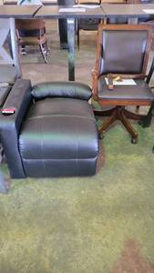 lot 4308 image: Black Faux Leather Movie Theater Chair and a Faux Leather Rolling Office Chair W Wooden Armrests
