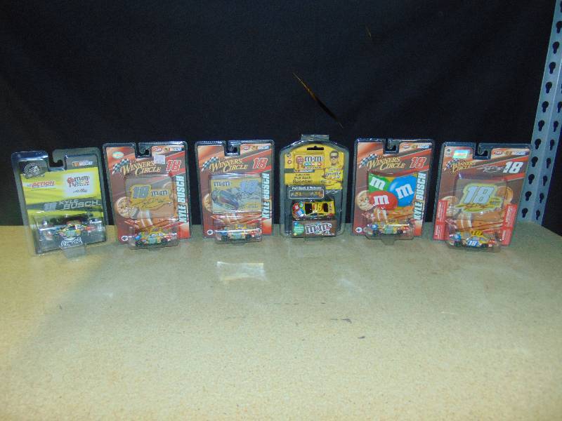 lot 4009 image: (6) pkg. lot M&Ms Racing Nascar #18 Kyle Bush Die-cast cars (hot-wheels size) Winners Circle, muscle Machine & Other brands