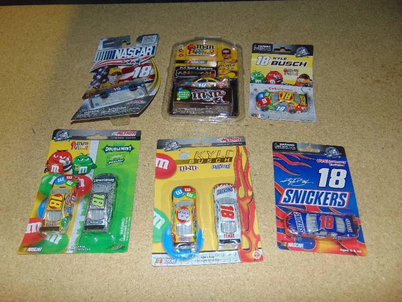 lot 4010 image: (6) ct. lot M&Ms, Snickers, Wrigleys Nascar #18 Kyle Bush die cast cars(hot wheel size) Winners Circle, Muscle machine, others