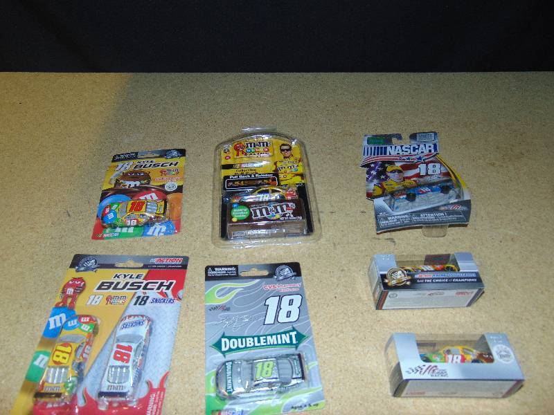 lot 4011 image: (7) ct. lot M&Ms, Snickers, Wrigleys Nascar #18 Kyle Bush die cast cars(hot wheel size) Winners Circle, Muscle machine, others
