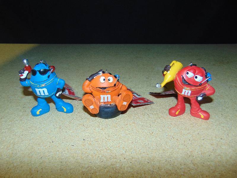 lot 4012 image: (3) ct. lot M&Ms Pit Crew Ornaments 2010