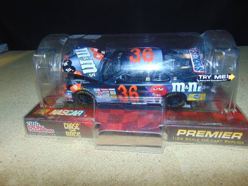 lot 4019 image: Ken Schrader #36 M&Ms Racing 124 scale die-cast car, Racing Champions, (black w red)