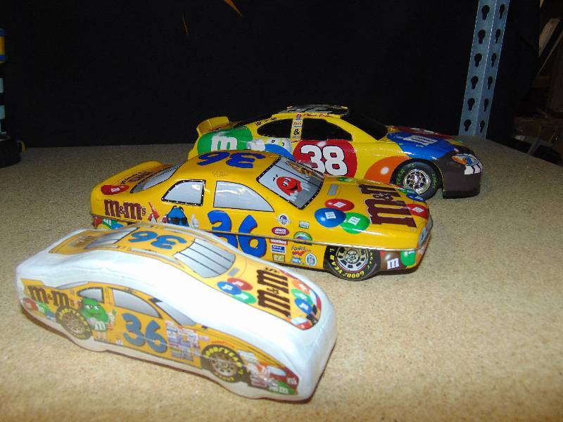 lot 4026 image: (3) ct. lot M&Ms Racing Memorabilia (1) Car Tin #36, (1) Car toy #38, (1) Car T-shirt #36