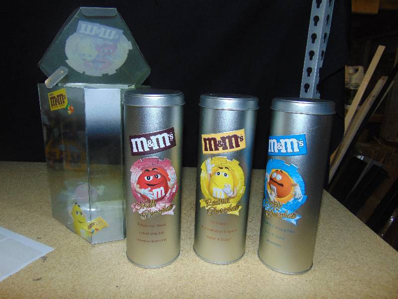 lot 4047 image: (3) ct. lot M&Ms Foreign Collectible Tins Chocolate, Peanut & Crispy- tins are empty