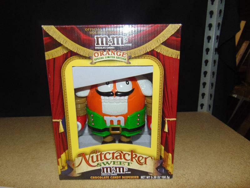 lot 4074 image: The Nutcracker Suite M&Ms Dispenser, in Orange, in original box